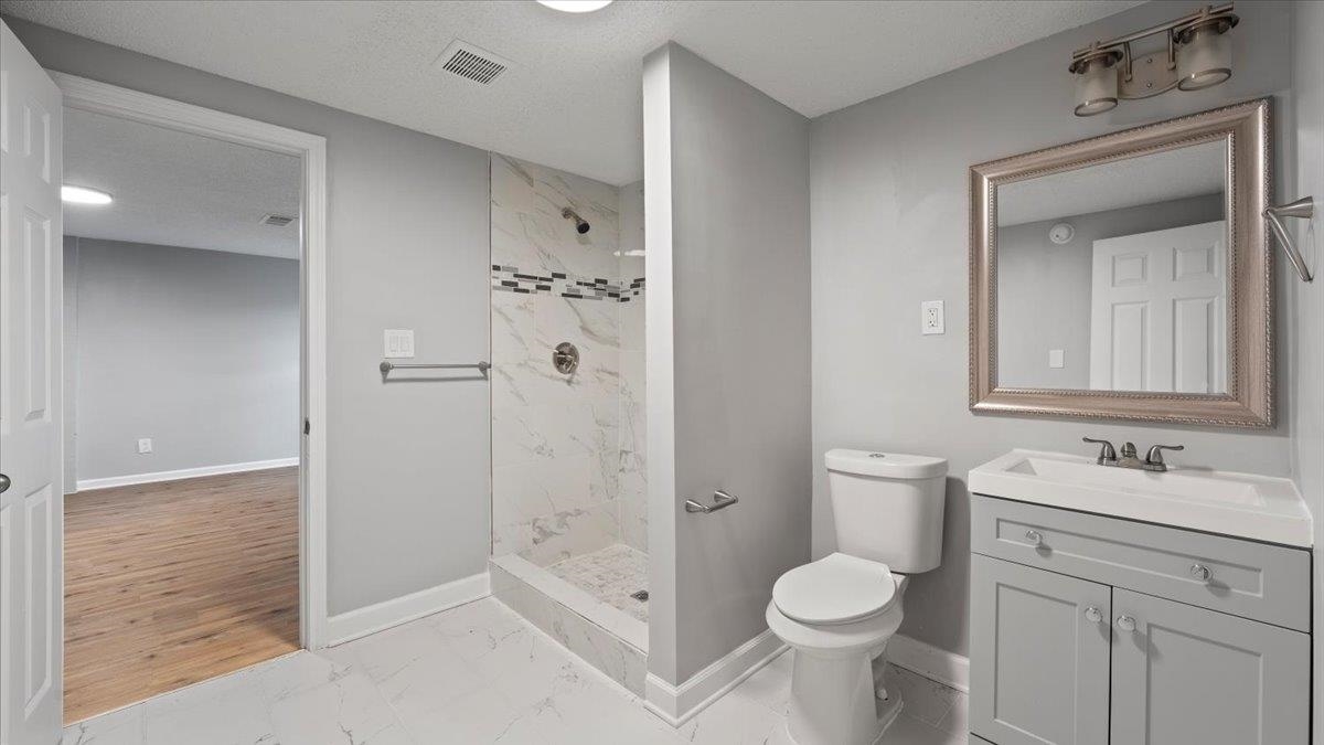 3817 Cazassa Road Memphis, TN 38116 - Photo 16 of 22 a bathroom with a sink toilet and shower