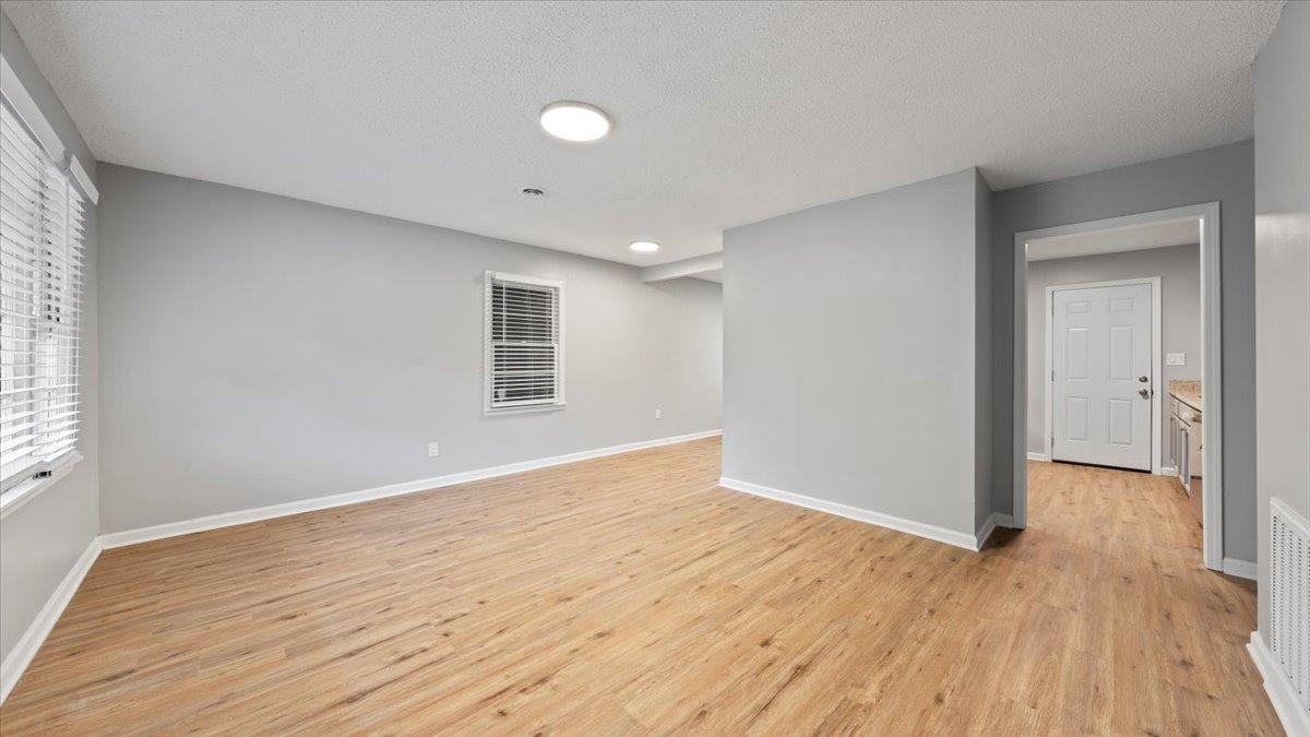 3817 Cazassa Road Memphis, TN 38116 - Photo 2 of 22 a view of empty room with wooden floor and fan