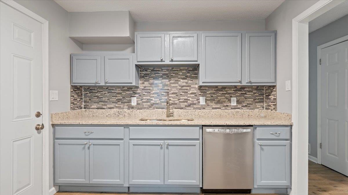 3817 Cazassa Road Memphis, TN 38116 - Photo 6 of 22 a kitchen with white cabinets