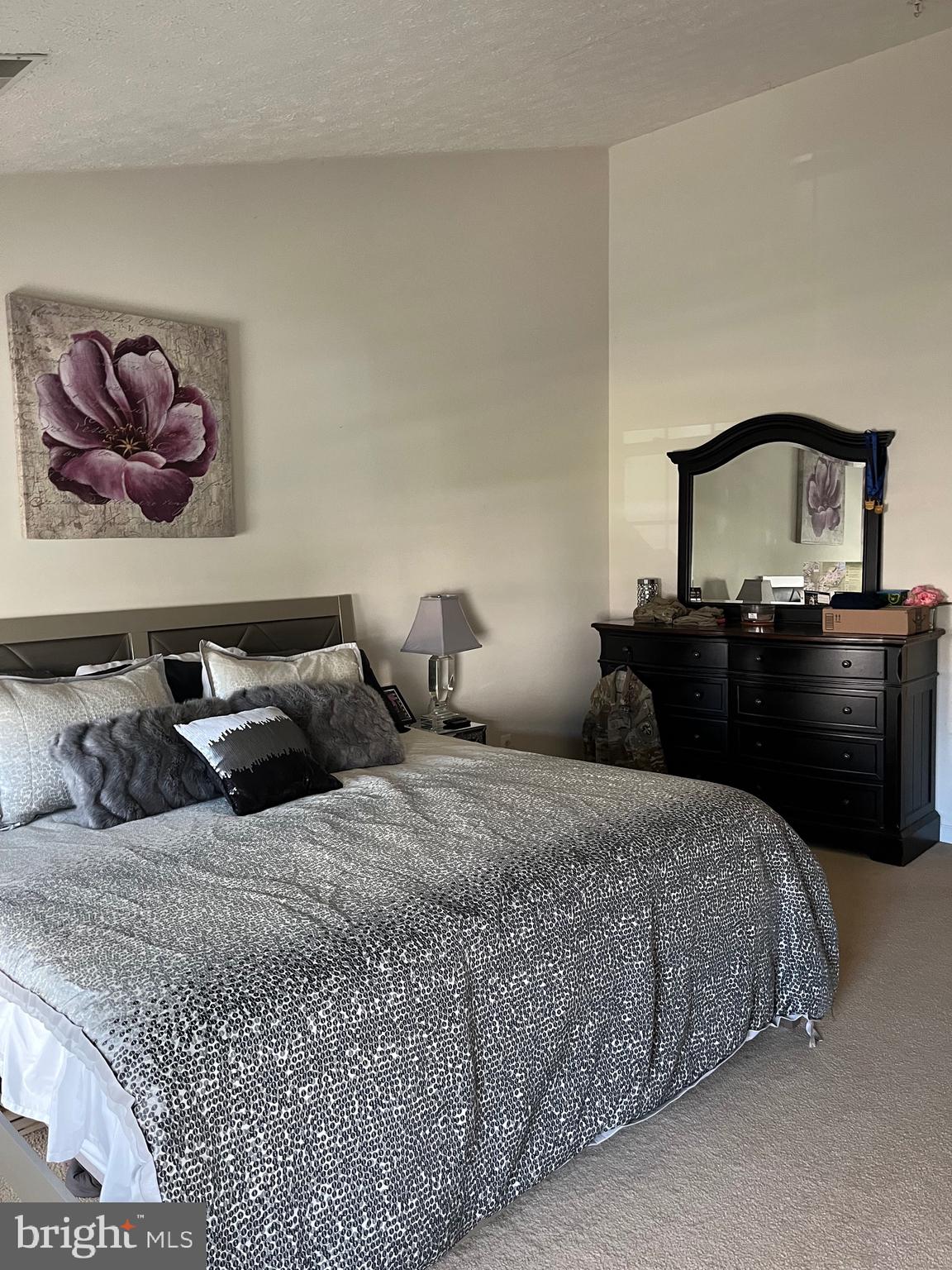 4817 Atlas Cedar Way Aberdeen, MD 21001 - Photo 17 of 21 a bedroom with bed and cabinet