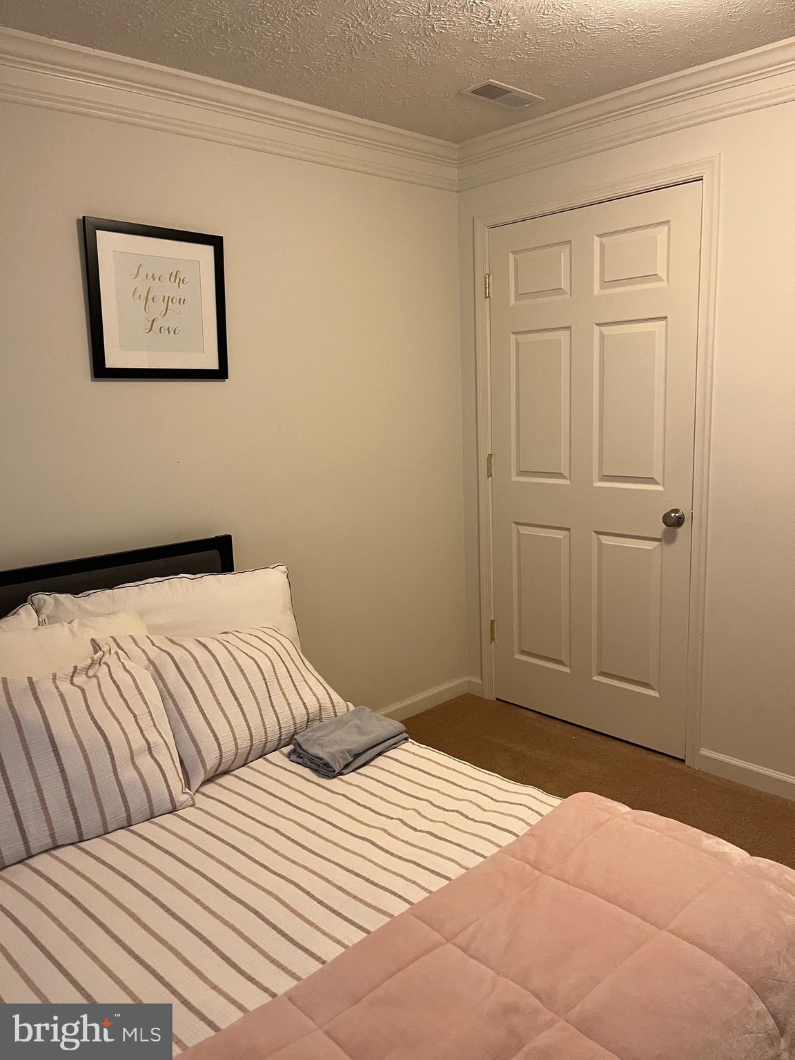 4817 Atlas Cedar Way Aberdeen, MD 21001 - Photo 20 of 21 a bedroom with a bed and painting on the wall