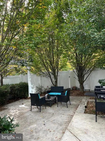 a backyard of a house with outdoor seating