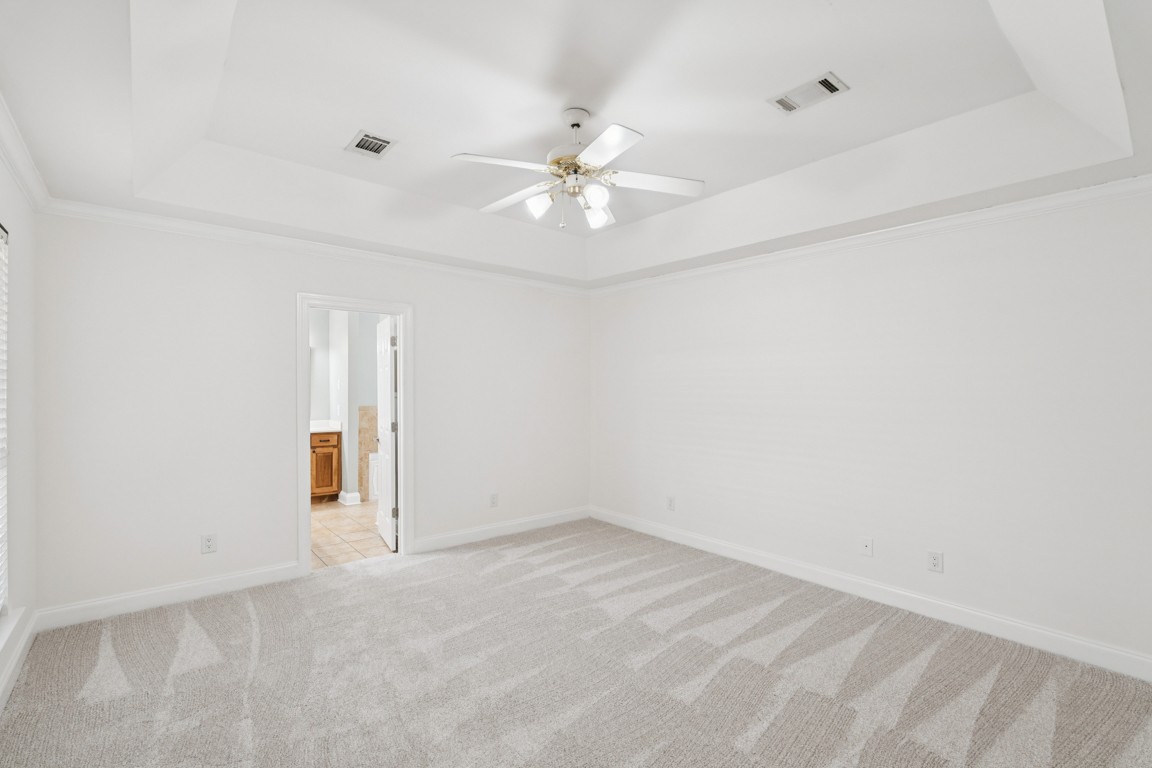 8552 Sawyer Brown Road Nashville, TN 37221 - Photo 16 of 25 an empty room with closet and a ceiling fan