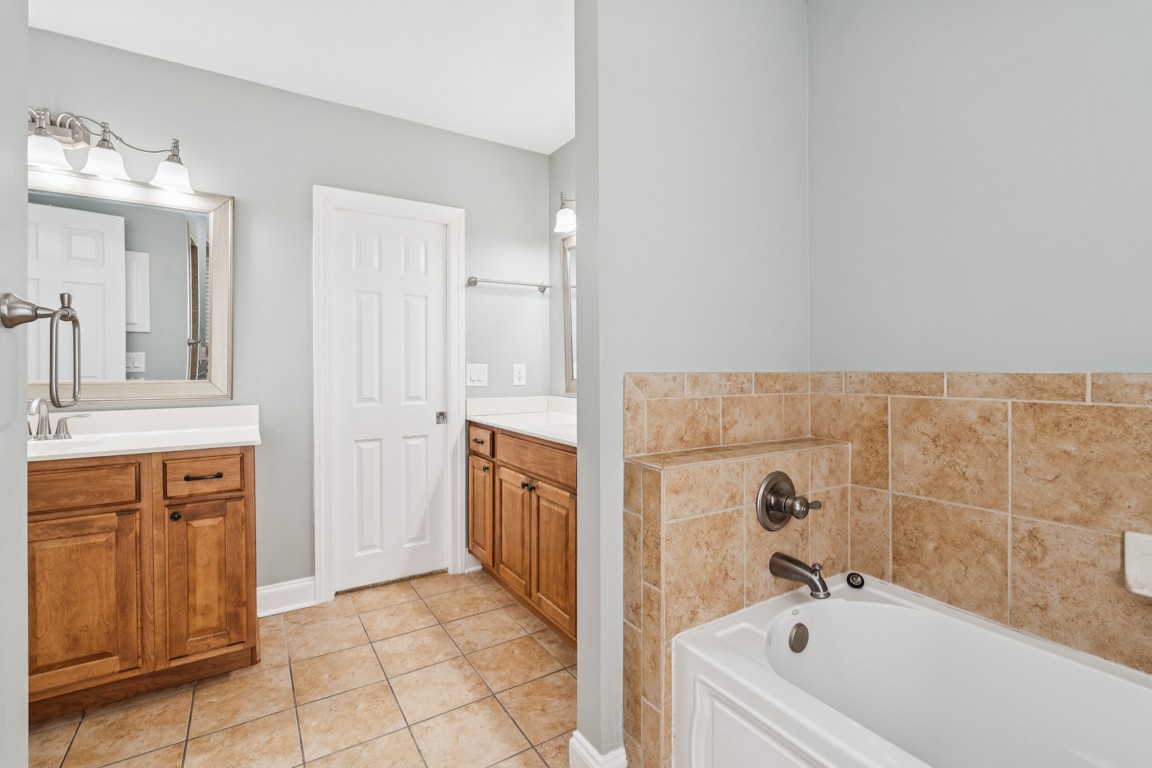 8552 Sawyer Brown Road Nashville, TN 37221 - Photo 18 of 25 a bathroom with a tub sink and mirror