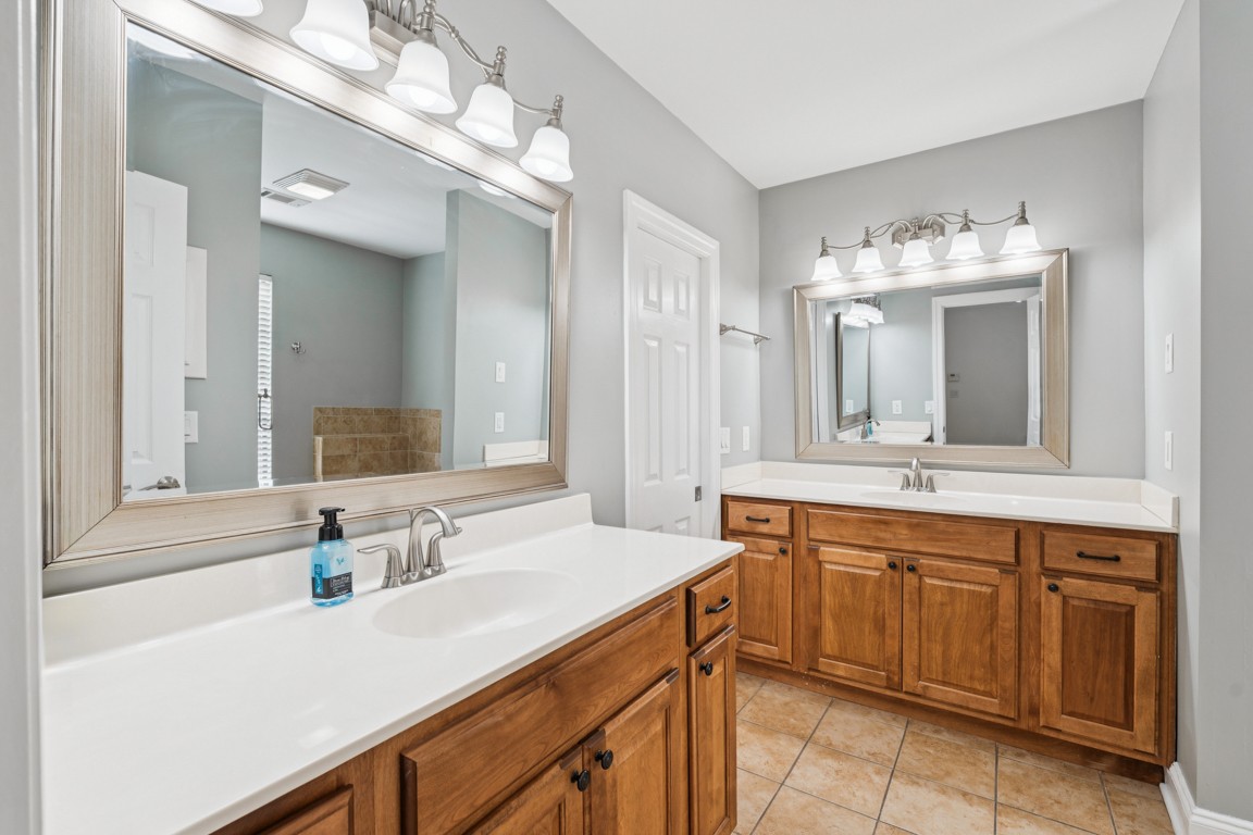 8552 Sawyer Brown Road Nashville, TN 37221 - Photo 19 of 25 a bathroom with a sink double vanity and a mirror