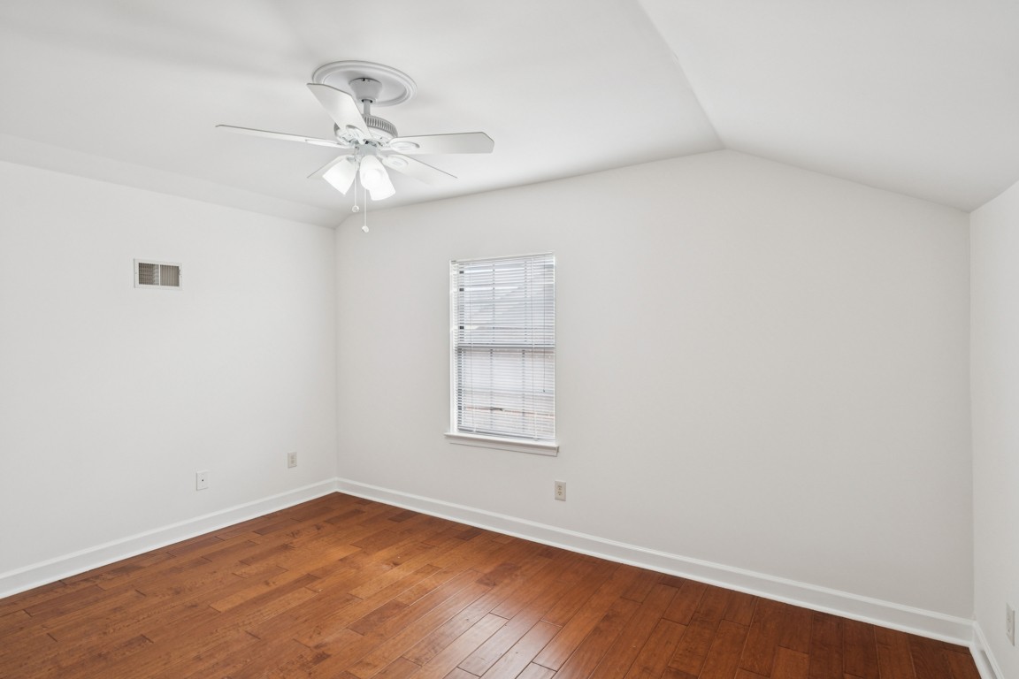 8552 Sawyer Brown Road Nashville, TN 37221 - Photo 20 of 25 an empty room with wooden floor fan and windows