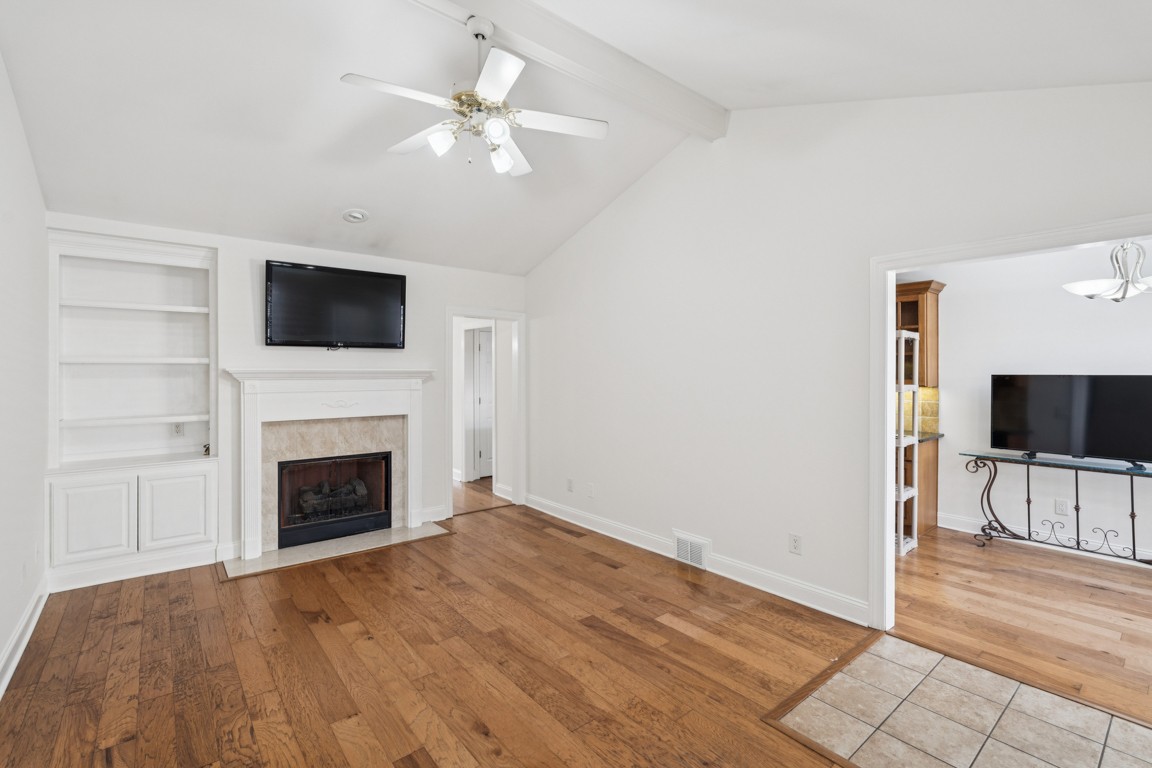 8552 Sawyer Brown Road Nashville, TN 37221 - Photo 2 of 25 a view of livingroom with a fireplace wooden floor and window