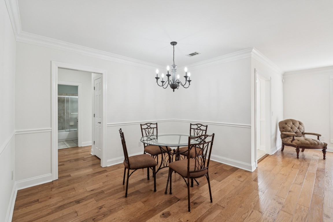 8552 Sawyer Brown Road Nashville, TN 37221 - Photo 4 of 25 a view of a dining room with furniture wooden floor and chandelier