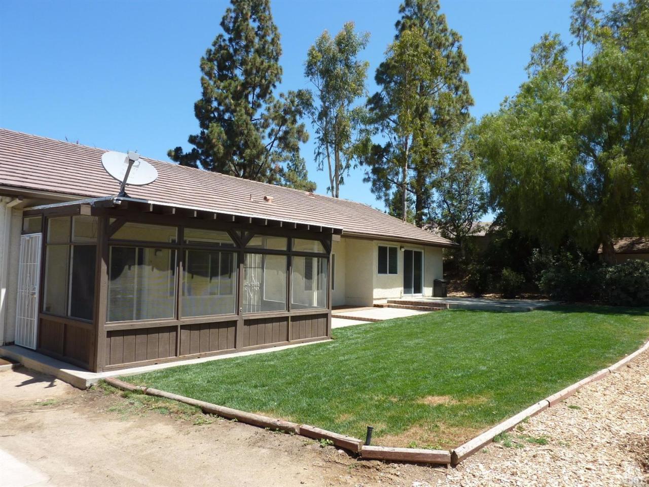 192 Wrangler Road Simi Valley, CA 93065 - Photo 29 of 40 a front view of a house with a yard and porch