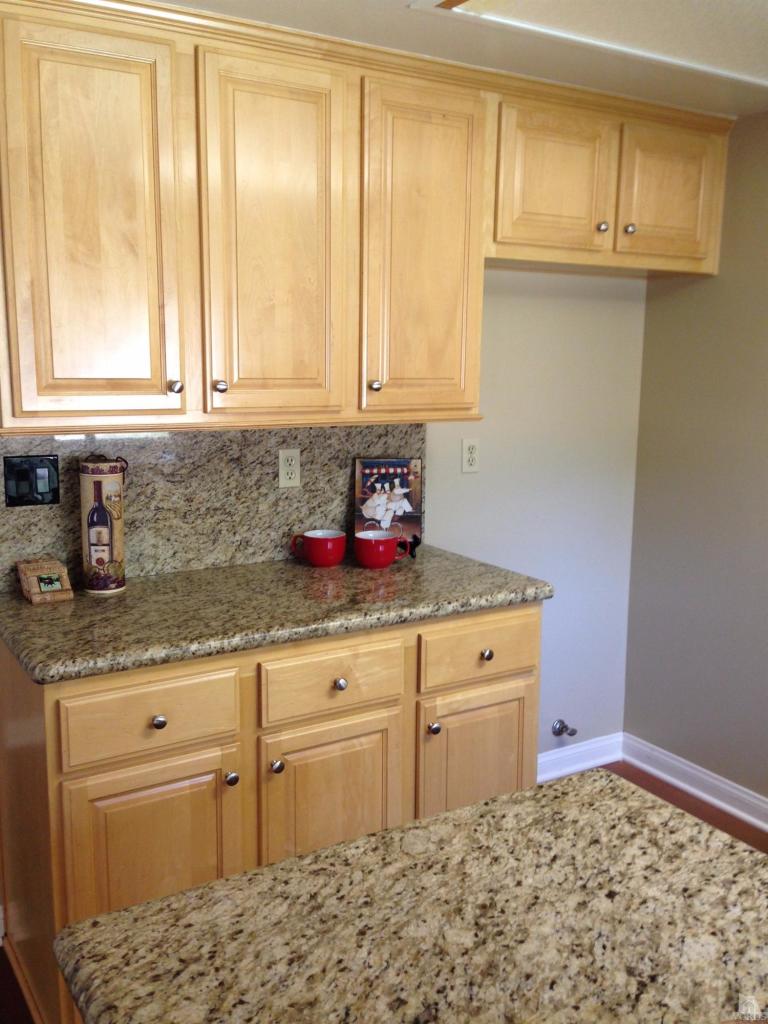 192 Wrangler Road Simi Valley, CA 93065 - Photo 8 of 40 a kitchen with granite countertop cabinets and window