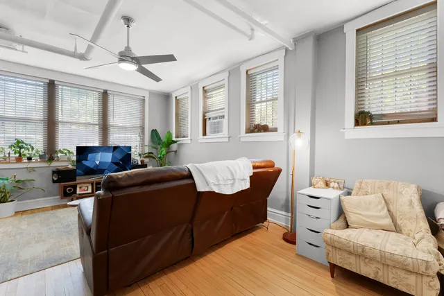a living room with furniture and windows