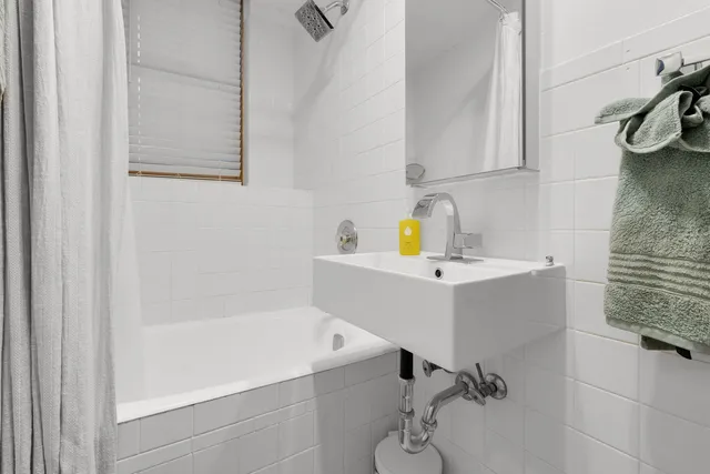 a bathroom with a sink and a bathtub
