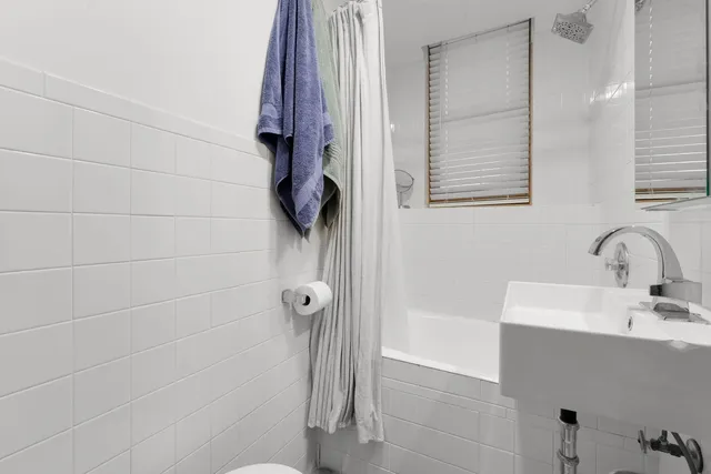 a bathroom with a sink and a shower