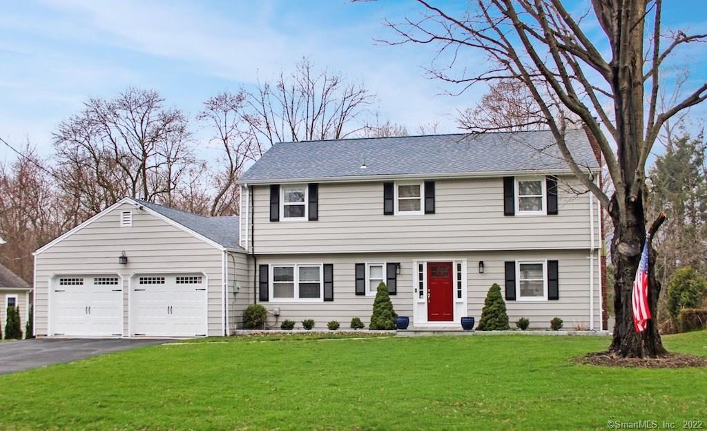 202 Club Road Stamford, CT 06905 - Photo 1 of 1 a front view of a house with a garden and trees