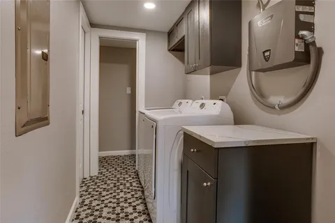 a bathroom with a granite countertop sink a toilet and a mirror