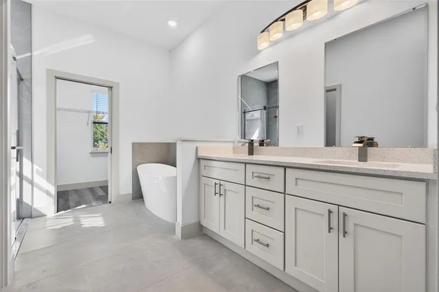 a bathroom with a bathtub and a shower