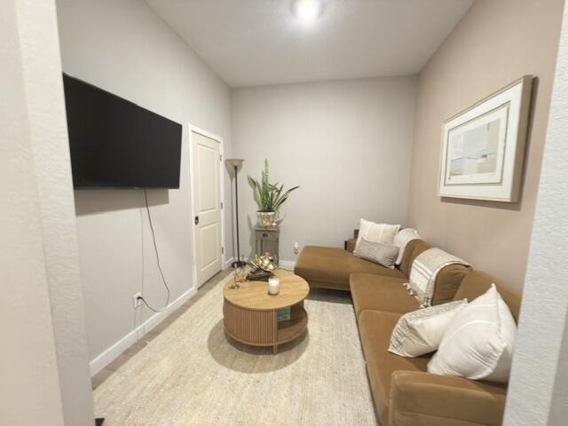 19696 Weathervane Way Loxahatchee, FL 33470 - Photo 3 of 39 a living room with furniture and a flat screen tv