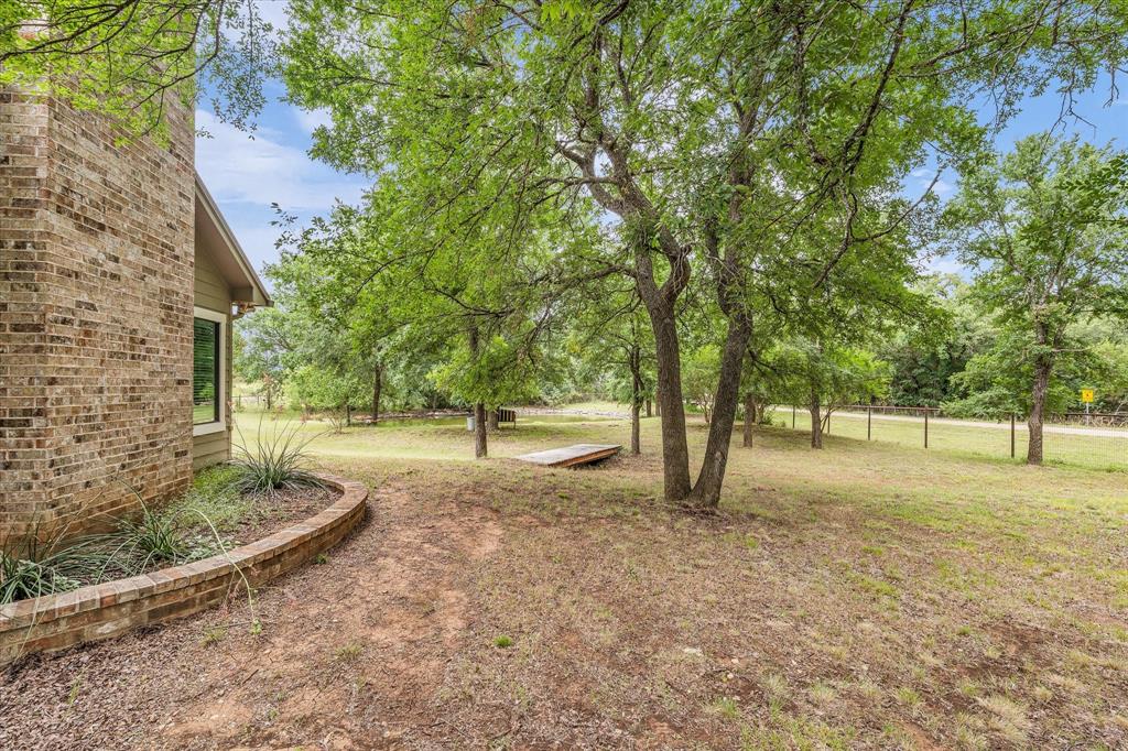 613 Bone Road Valley Mills, TX 76689 - Photo 30 of 40 a view of backyard with tree
