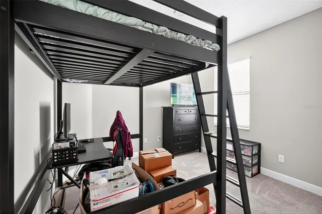 a bedroom with furniture and air hockey table