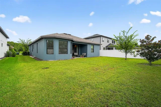 a house with a tree in front of it