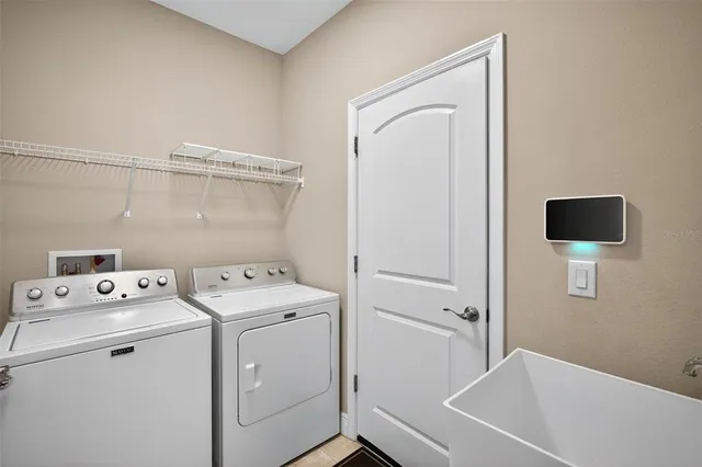 a utility room with dryer and washer