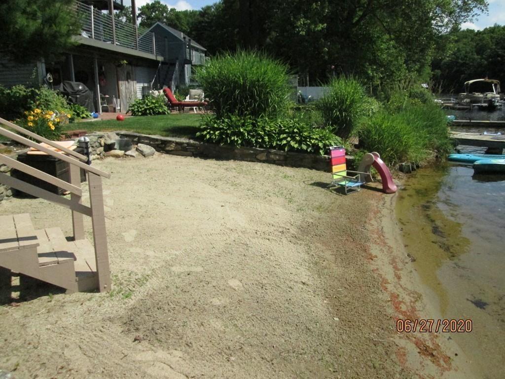 44 Ridge Trail Douglas, MA 01516 - Photo 12 of 22 a view of a backyard with plants and a patio