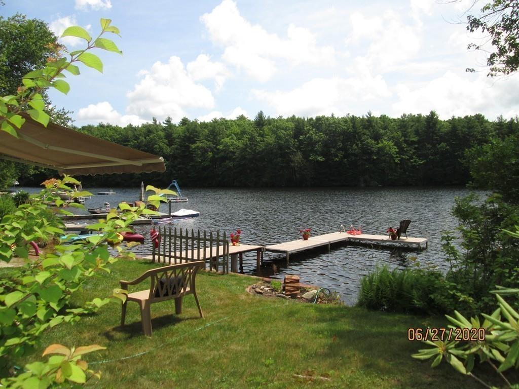 44 Ridge Trail Douglas, MA 01516 - Photo 16 of 22 a view of a lake with a bench in a lake
