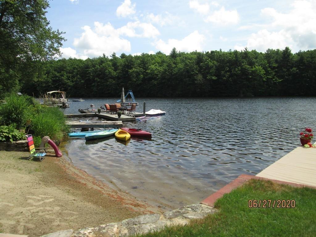 44 Ridge Trail Douglas, MA 01516 - Photo 17 of 22 a view of a lake with sitting area