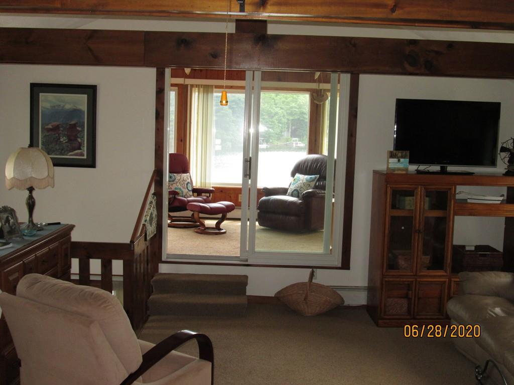 44 Ridge Trail Douglas, MA 01516 - Photo 20 of 22 a living room with furniture and a flat screen tv