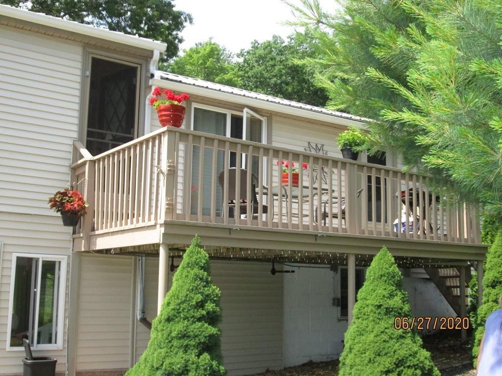 44 Ridge Trail Douglas, MA 01516 - Photo 7 of 22 a house view with a garden space