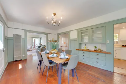 a view of a dining room with furniture window and wooden floor
