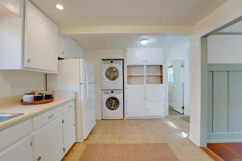 a room with a dresser sink and mirror