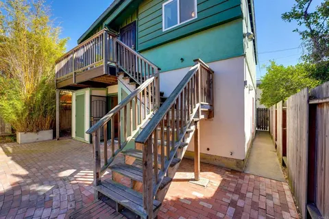 a view of a balcony with wooden floor