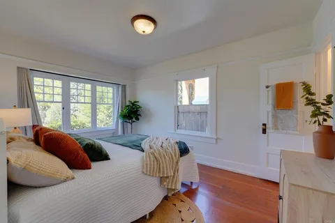 a bedroom with furniture and a window