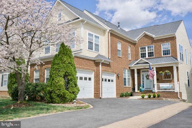 21625 Merion Street Ashburn, VA 20147 - Photo 22 of 80 front view of a brick house with a yard
