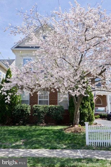 21625 Merion Street Ashburn, VA 20147 - Photo 24 of 80 a front view of a house with a garden