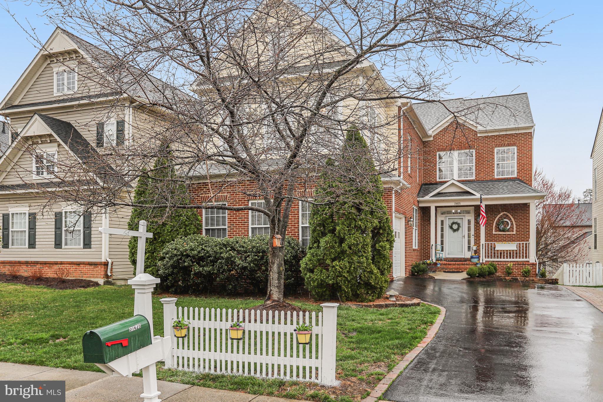 21625 Merion Street Ashburn, VA 20147 - Photo 25 of 80 a front view of a house with a yard