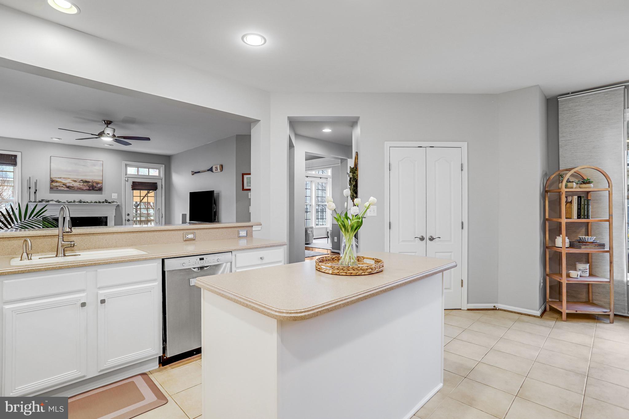 21625 Merion Street Ashburn, VA 20147 - Photo 38 of 80 a kitchen with stainless steel appliances granite countertop a sink and cabinets