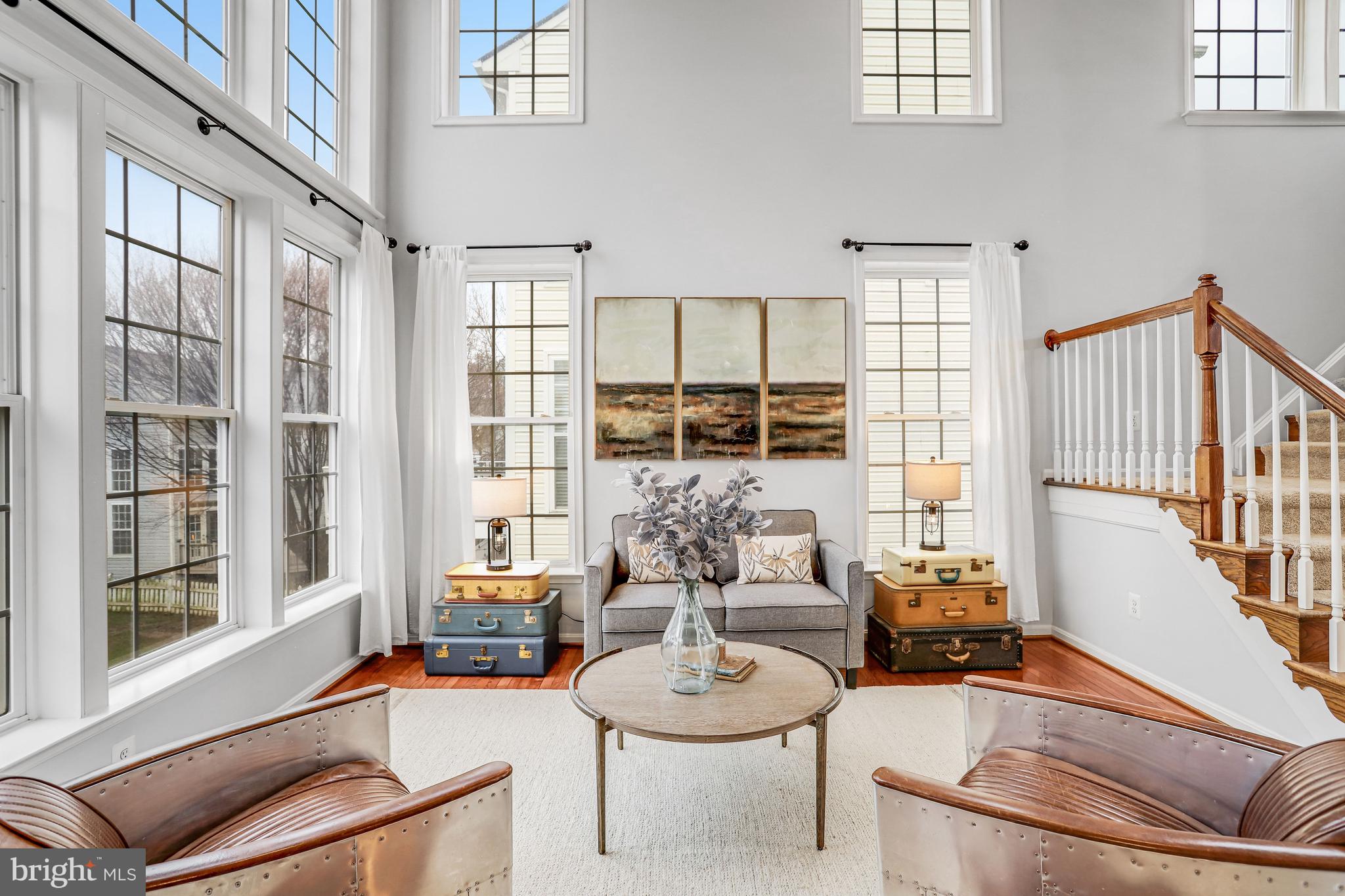 21625 Merion Street Ashburn, VA 20147 - Photo 4 of 80 a living room with furniture and a large window