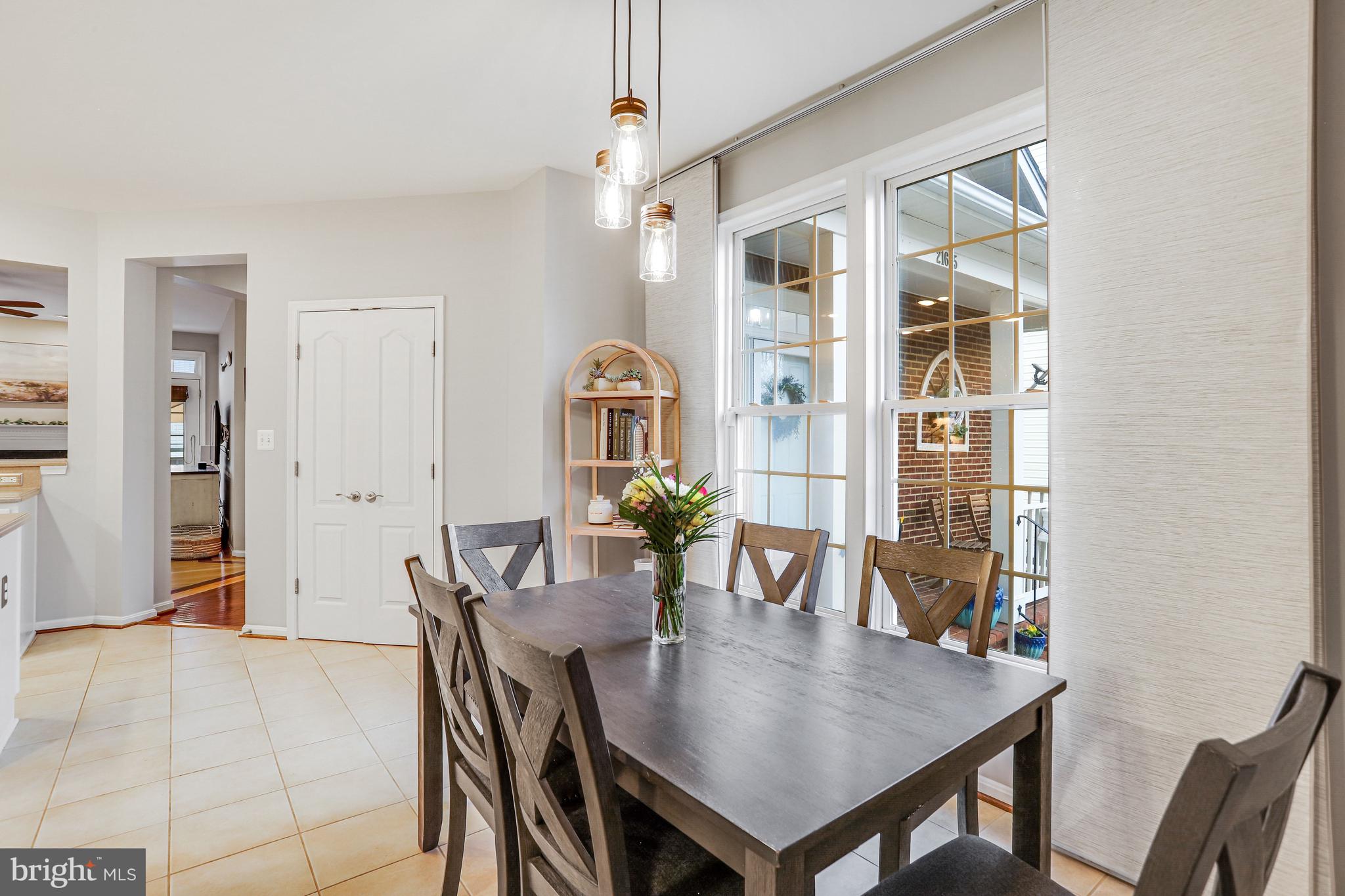 21625 Merion Street Ashburn, VA 20147 - Photo 41 of 80 a view of a dining room with furniture