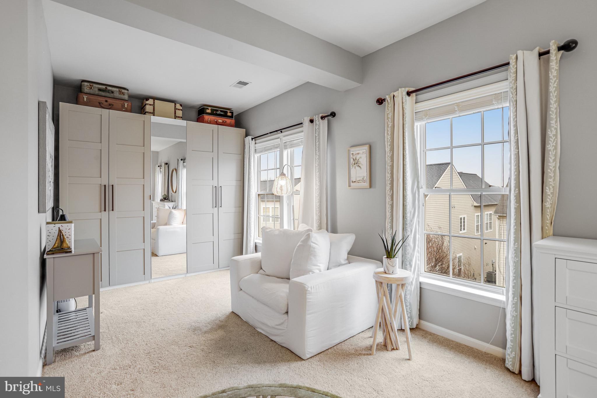 21625 Merion Street Ashburn, VA 20147 - Photo 48 of 80 a living room with furniture and a large window