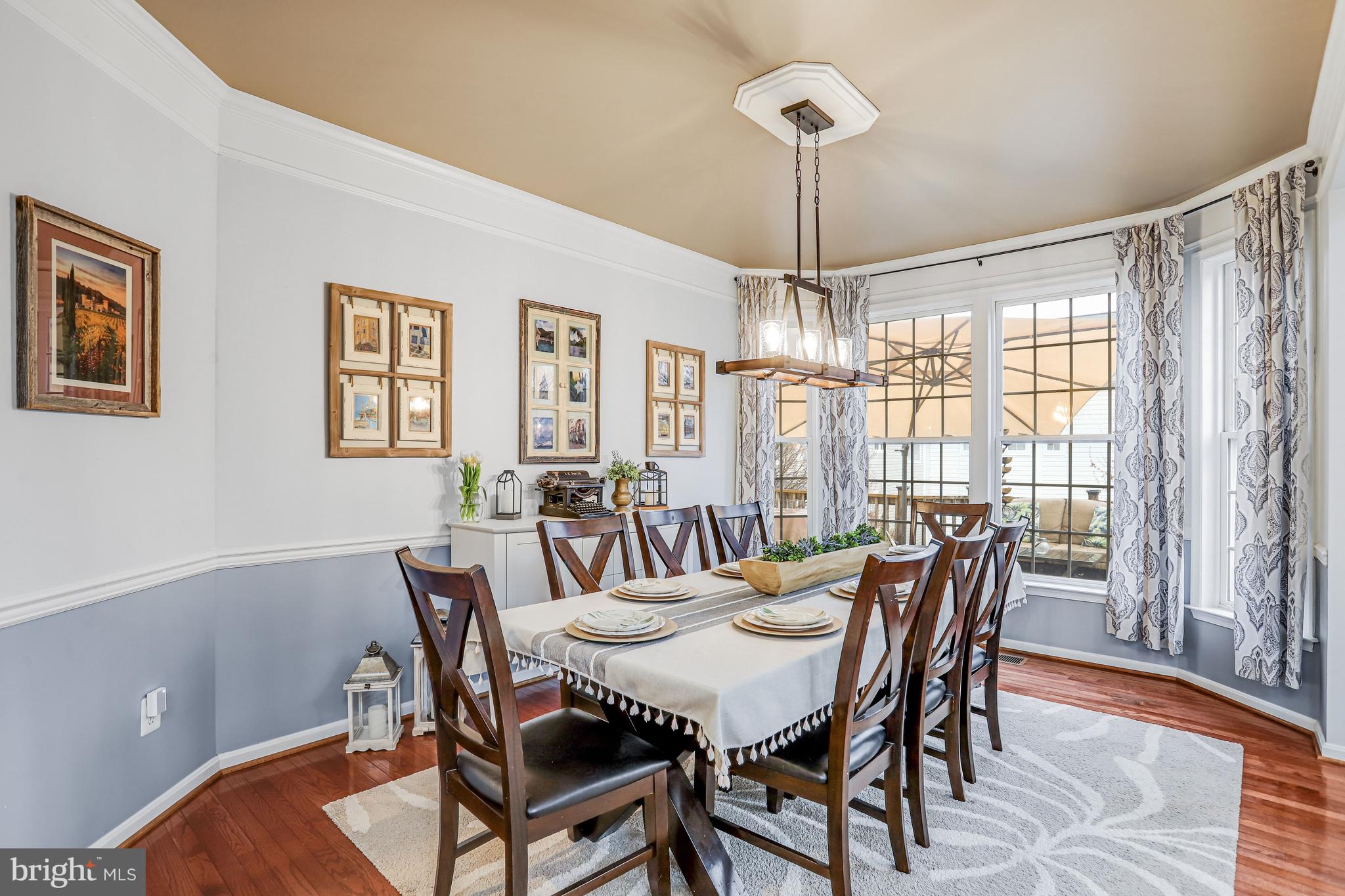 21625 Merion Street Ashburn, VA 20147 - Photo 5 of 80 a view of a dining room with furniture window and wooden floor