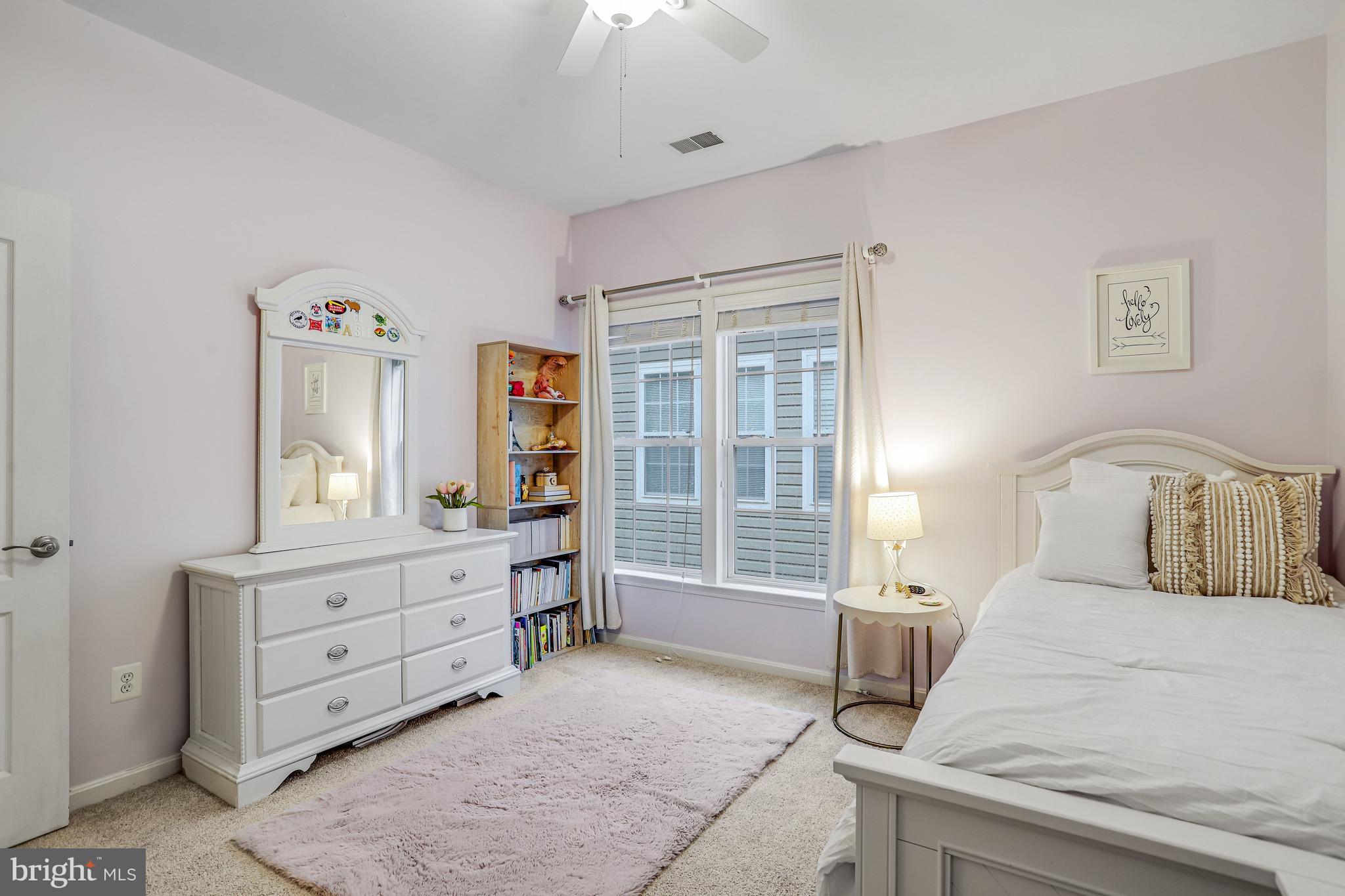 21625 Merion Street Ashburn, VA 20147 - Photo 56 of 80 a bedroom with a bed and a window