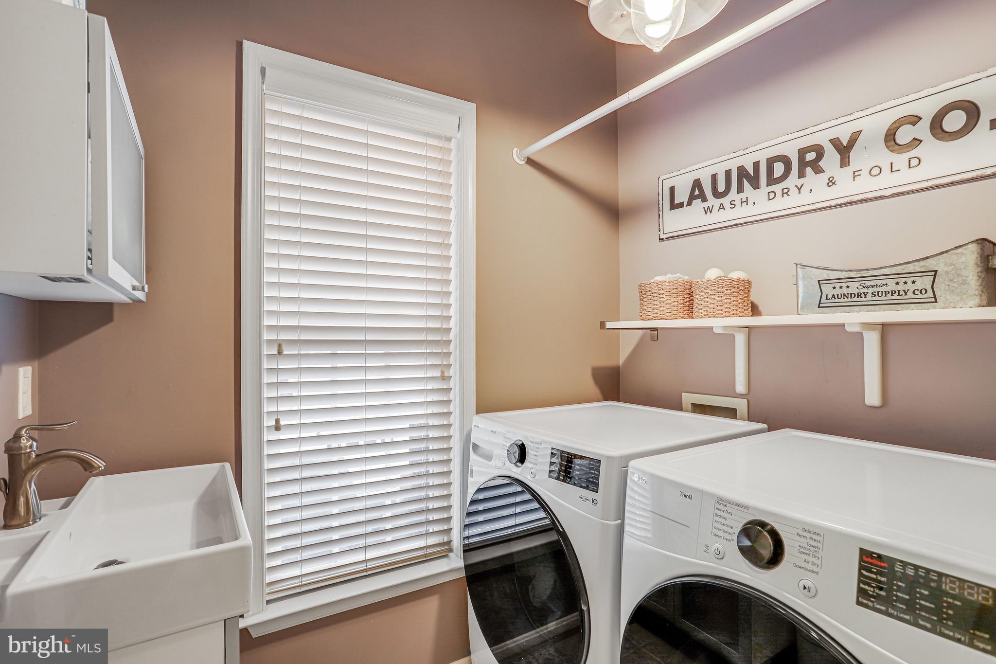 21625 Merion Street Ashburn, VA 20147 - Photo 60 of 80 a view of kitchen and utility room with washer and dryer