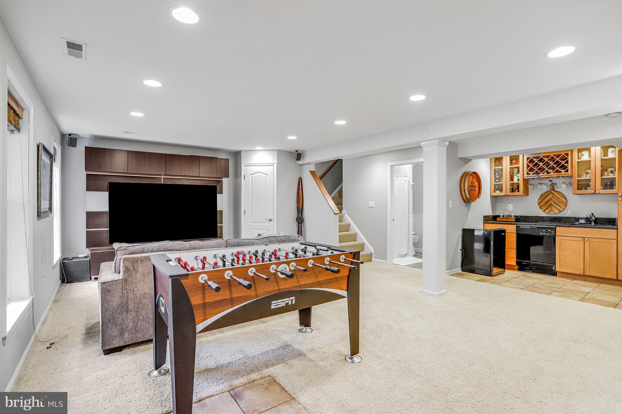 21625 Merion Street Ashburn, VA 20147 - Photo 64 of 80 a living room with furniture and a flat screen tv