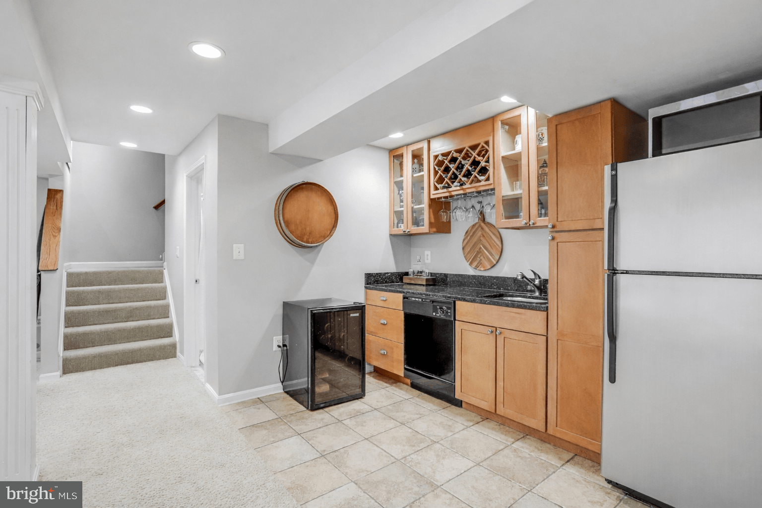 21625 Merion Street Ashburn, VA 20147 - Photo 68 of 80 a kitchen with stainless steel appliances granite countertop a refrigerator and a stove top oven