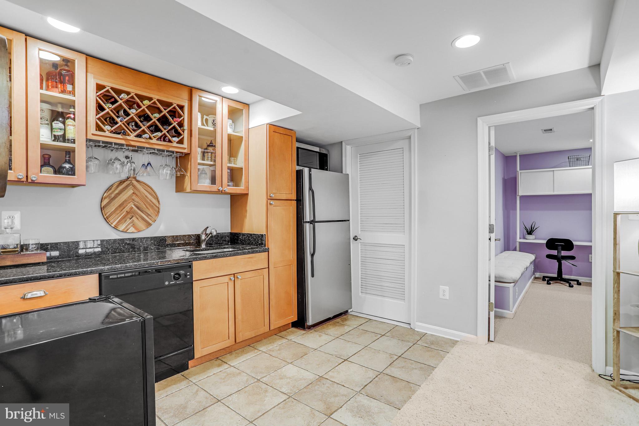 21625 Merion Street Ashburn, VA 20147 - Photo 69 of 80 a kitchen with stainless steel appliances granite countertop a stove a refrigerator and a refrigerator