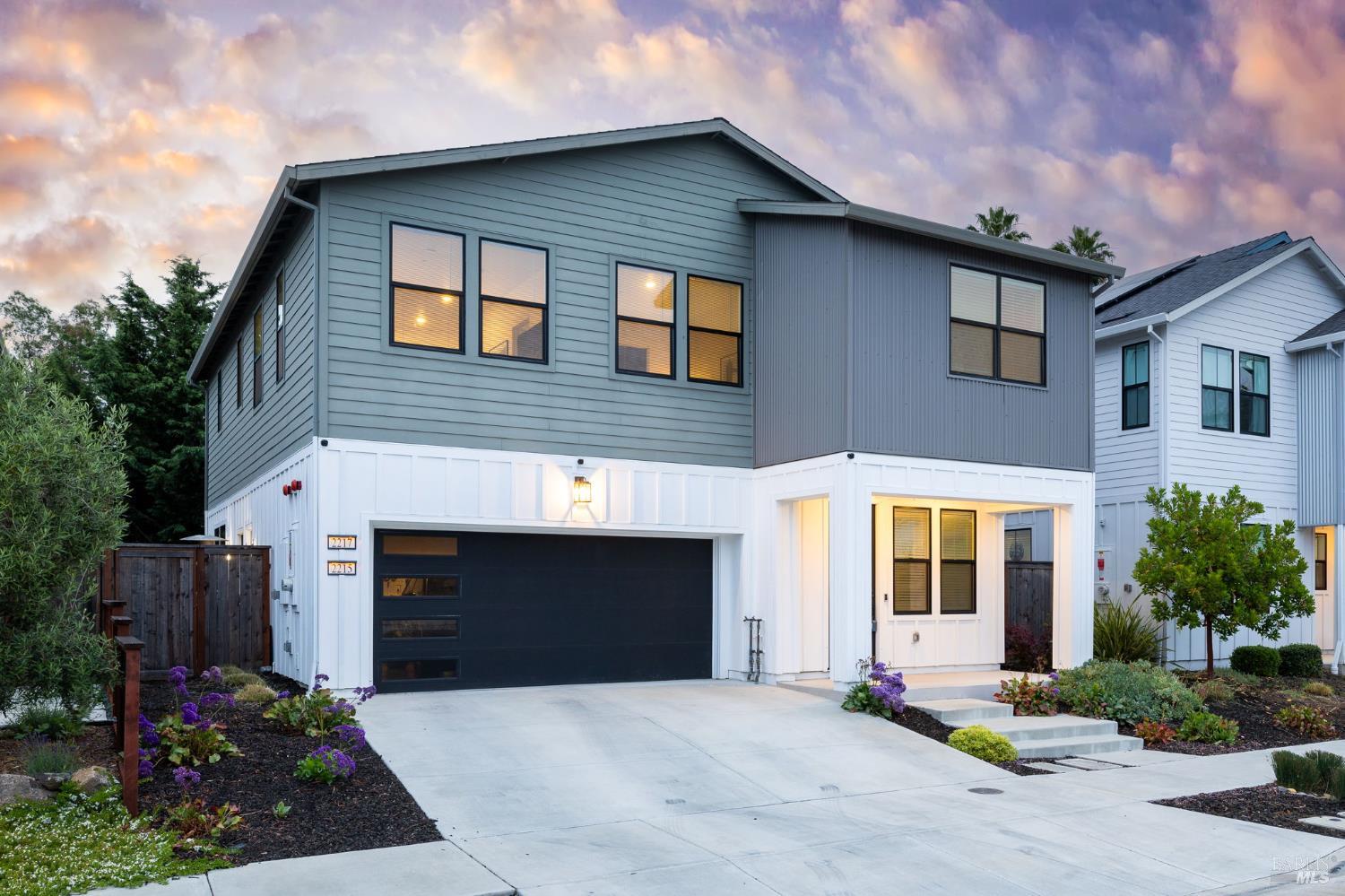 2215-2217 Versaro Drive Santa Rosa, CA 95403 - Photo 1 of 45 a front view of a house with yard and outdoor seating