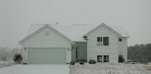 517 Pembroke Road Southwest Poplar Grove, IL 61065 - Photo 1 of 1 a front view of a house with a yard
