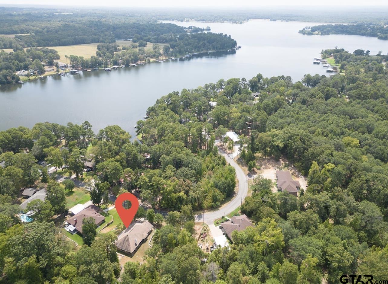 a aerial view of a house with a lake view